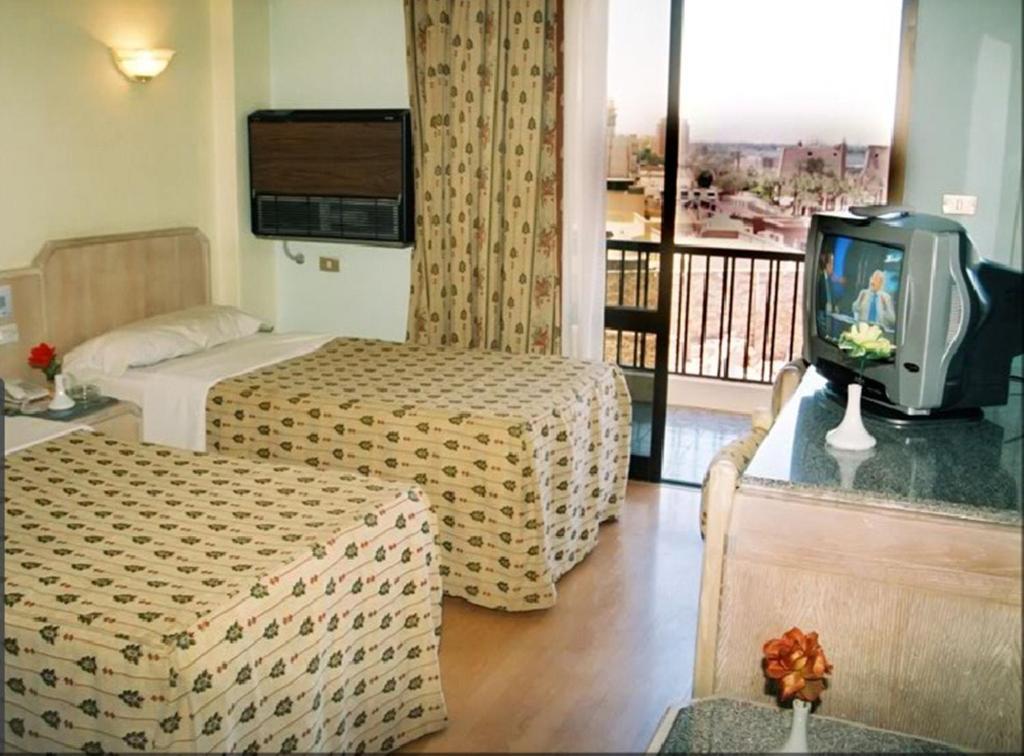 Emilio Hotel Luxor Szoba fotó